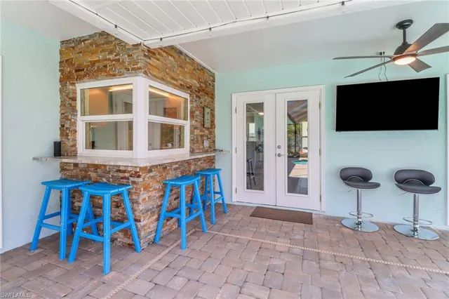 a front view of a house with outdoor seating