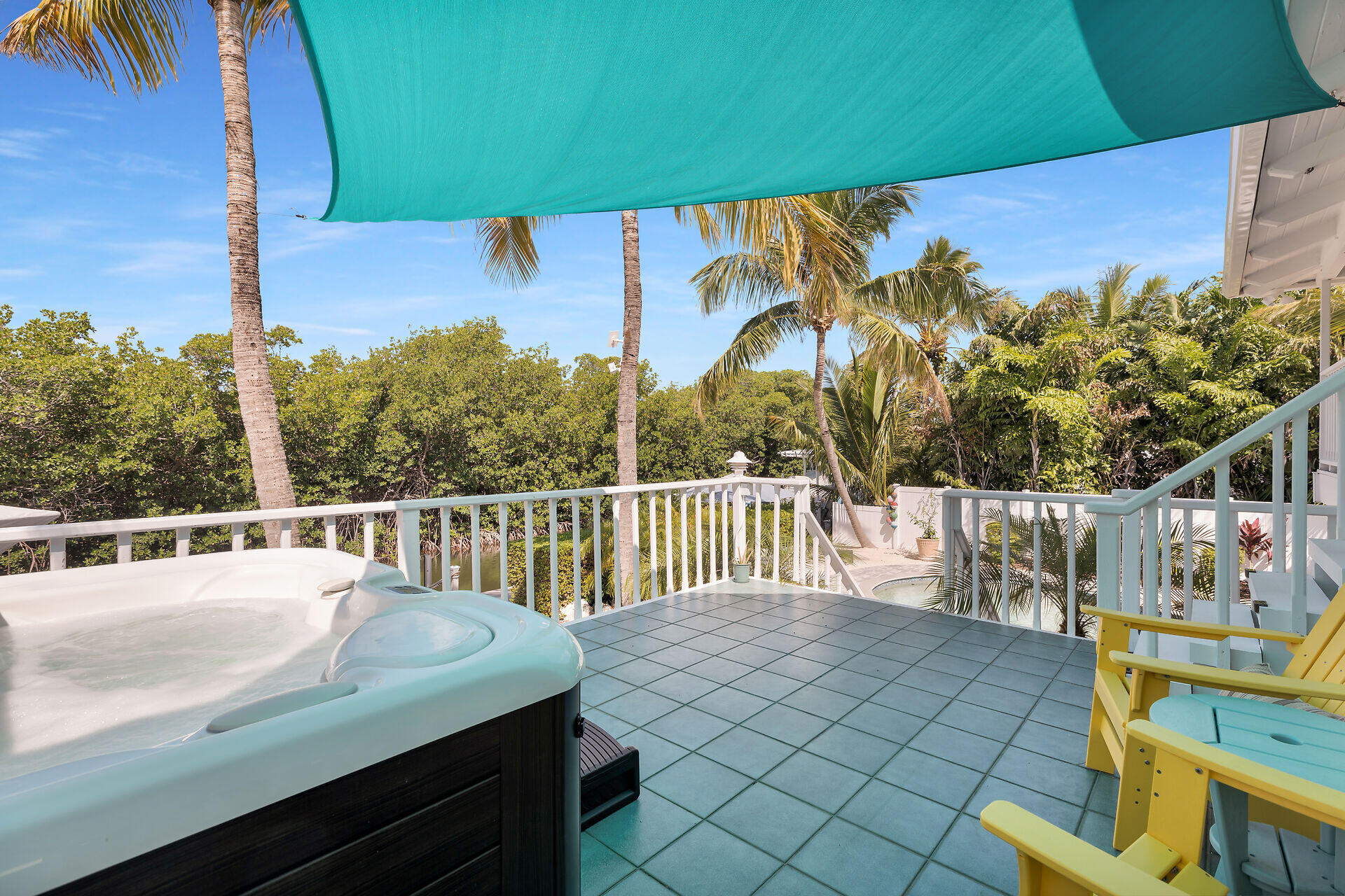 835 70th Street, Unit GULF Marathon, FL 33050 - Photo 12 of 46 a view of a balcony with chairs