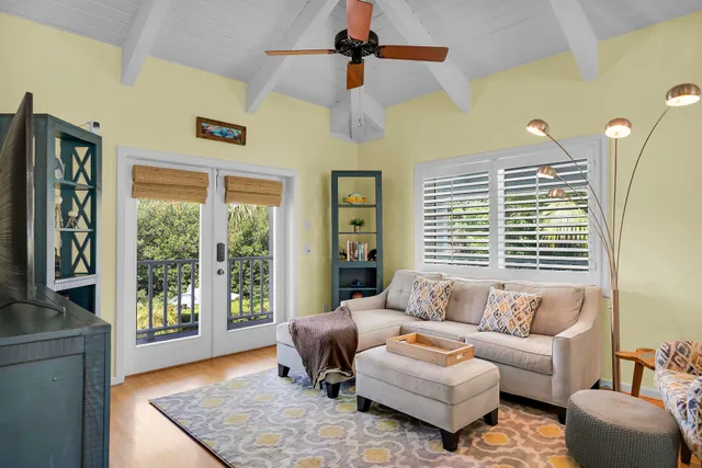 a view of a bedroom with furniture and windows