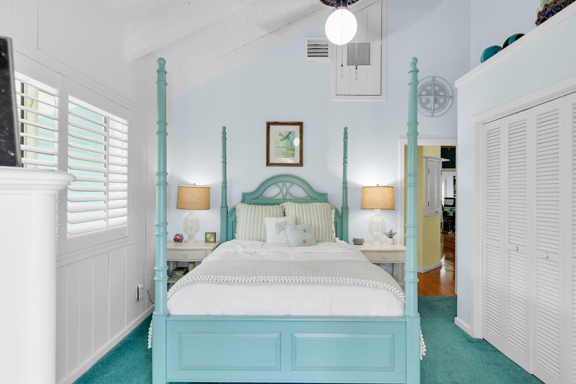 835 70th Street, Unit GULF Marathon, FL 33050 - Photo 32 of 46 a bedroom with a bed and a chandelier