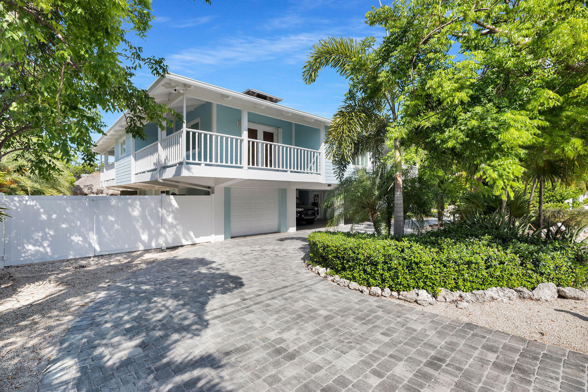 835 70th Street, Unit GULF Marathon, FL 33050 - Photo 39 of 46 a front view of a house with a yard and potted plants