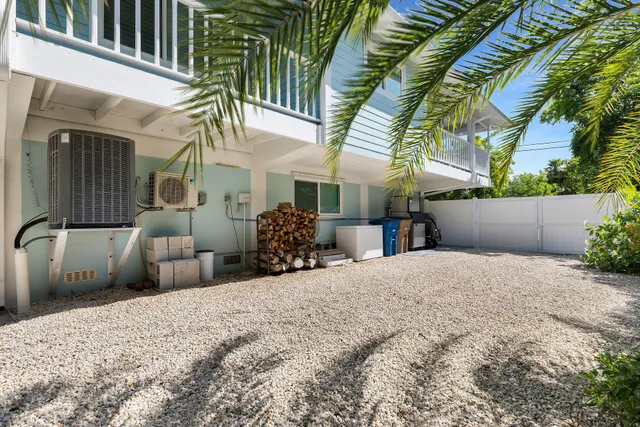 an aerial view of residential houses with outdoor space and street view