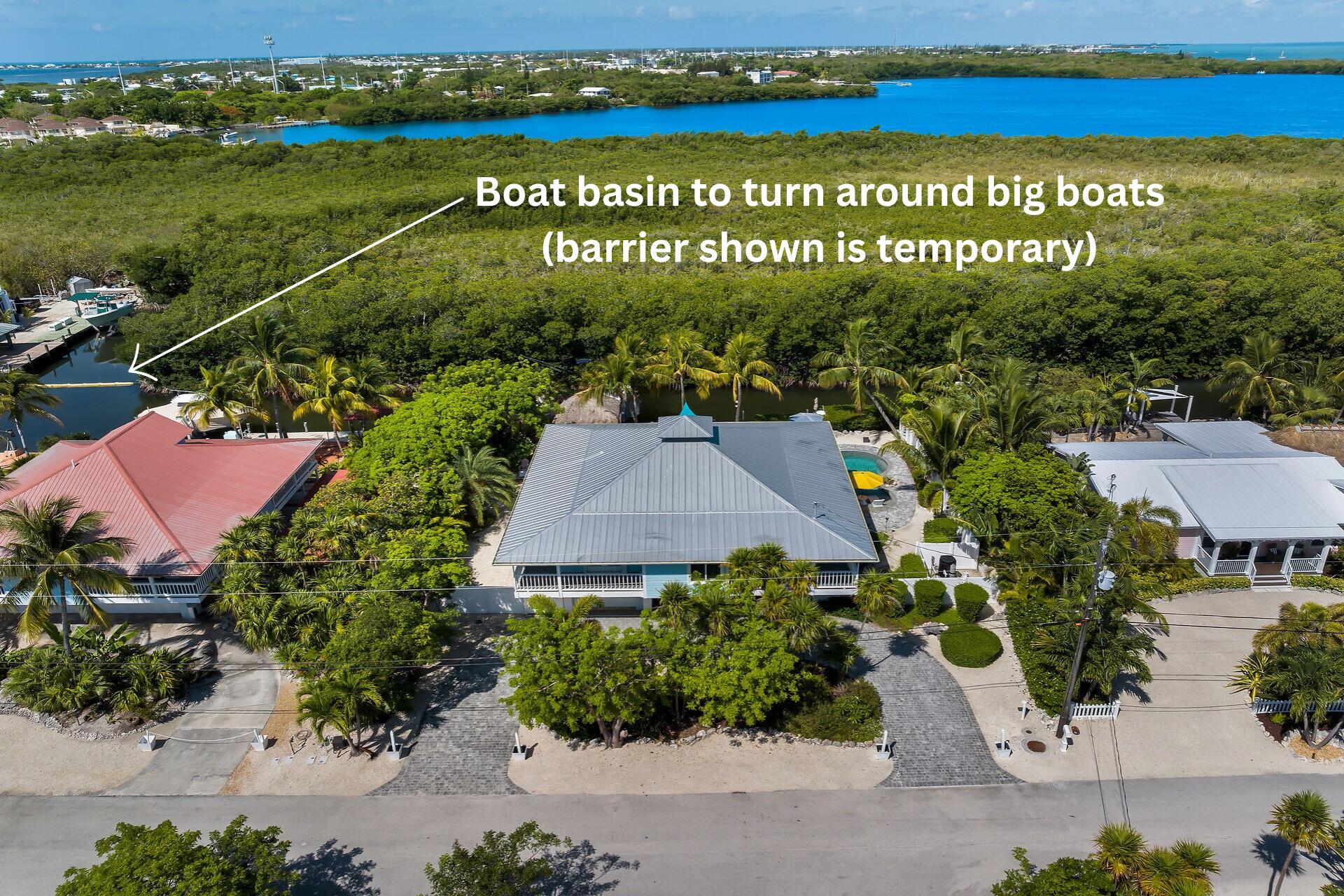 835 70th Street, Unit GULF Marathon, FL 33050 - Photo 41 of 46 an aerial view of residential houses with outdoor space and street view