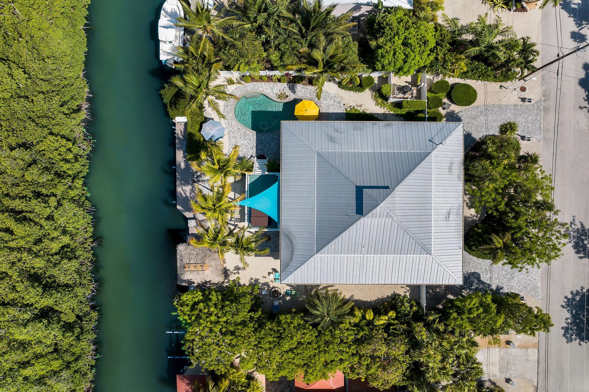 835 70th Street, Unit GULF Marathon, FL 33050 - Photo 44 of 46 an aerial view of a house with a yard and garden
