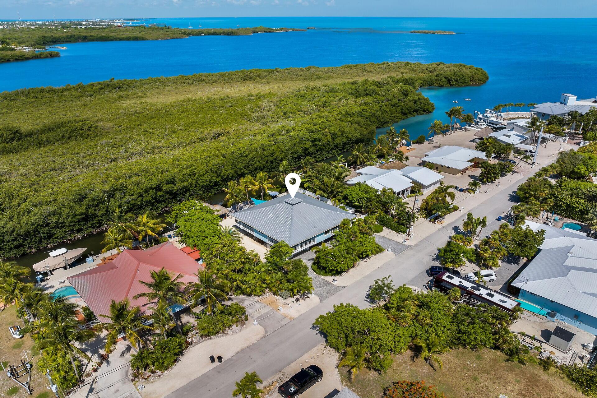 835 70th Street, Unit GULF Marathon, FL 33050 - Photo 45 of 46 an aerial view of residential houses with outdoor space and river