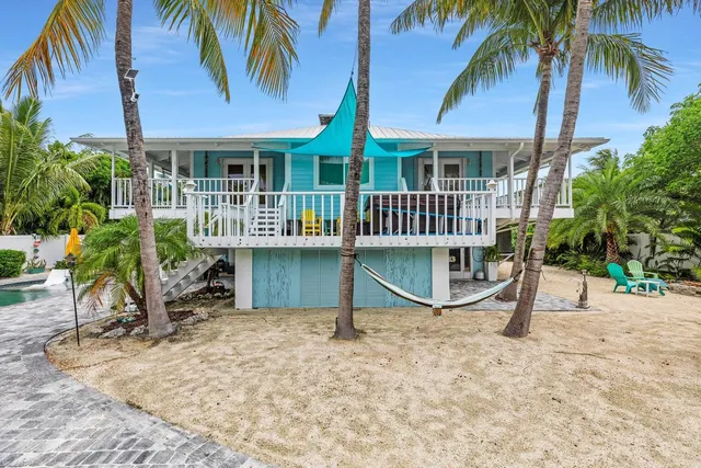 a view of a swimming pool with sitting area