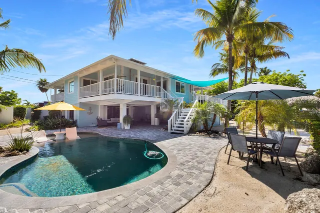 a view of a backyard with a patio