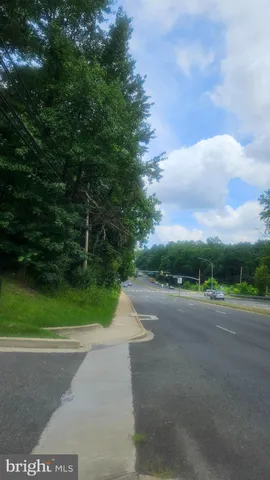a view of a road with a yard