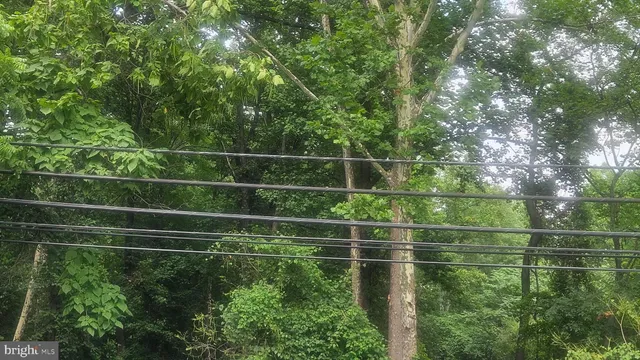 a view of a fence and tennis court