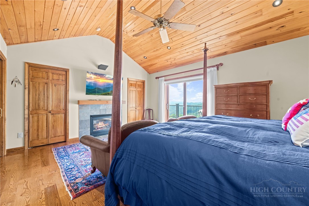 331 Alpine Road Blowing Rock, NC 28605 - Photo 26 of 50 a bed sitting in a spacious bedroom next to a window