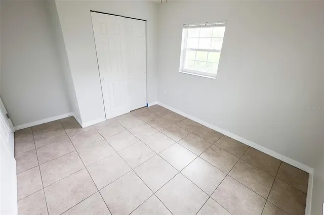 a view of an empty room and entryway