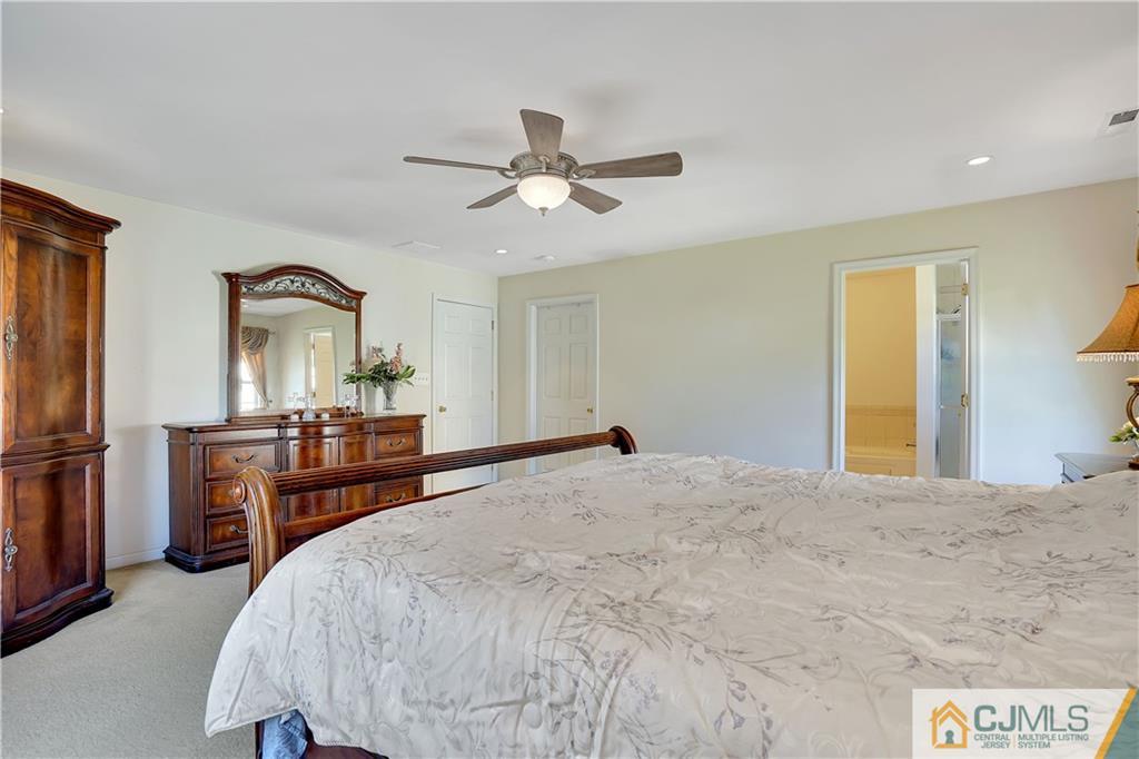 25 Cannon Road Old Bridge, NJ 08857 - Photo 22 of 40 a bedroom with a bed and dresser with mirror
