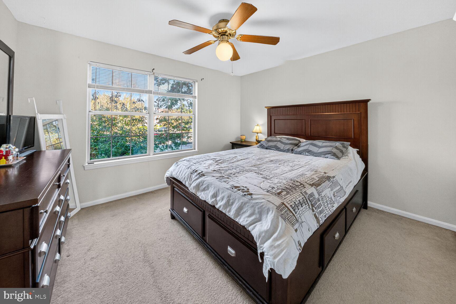 14901 McKisson Court, Unit 7CC Silver Spring, MD 20906 - Photo 12 of 34 a bedroom with a bed and a window