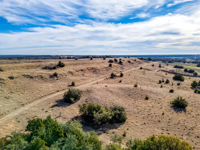 an aerial view of a beach with an ocean view