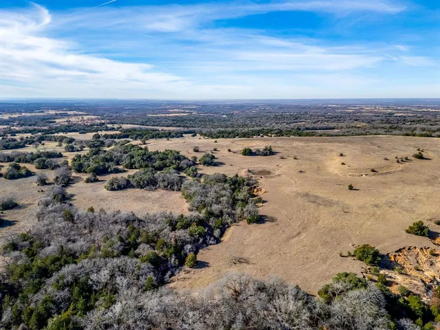 an aerial view of beach and building