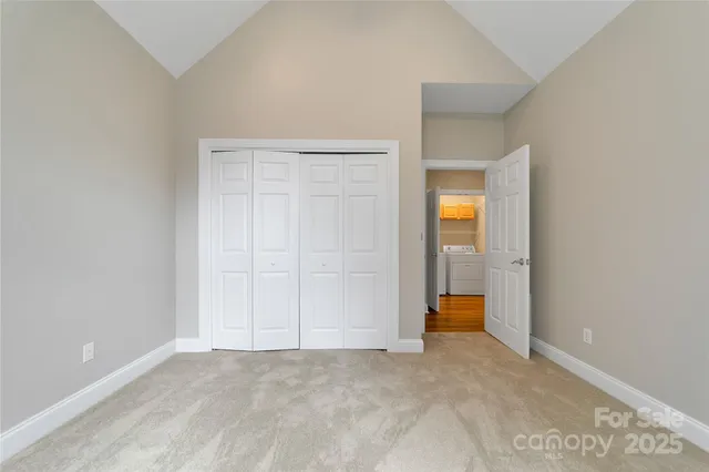 an empty room with a bathroom and a sink