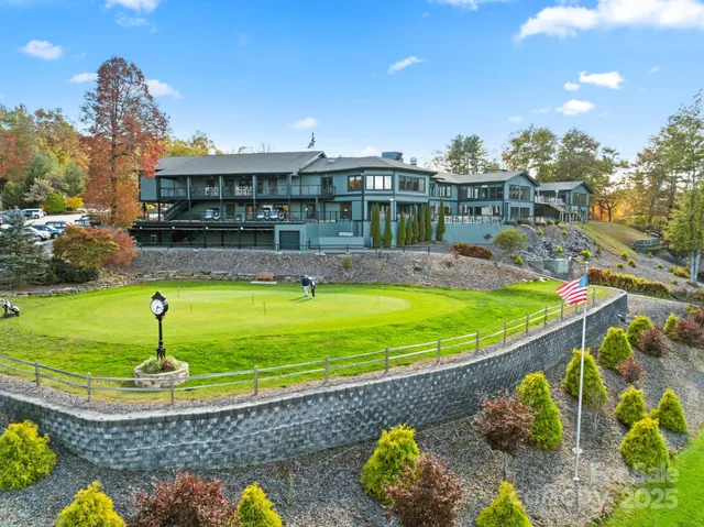 a view of a city from a balcony with furniture