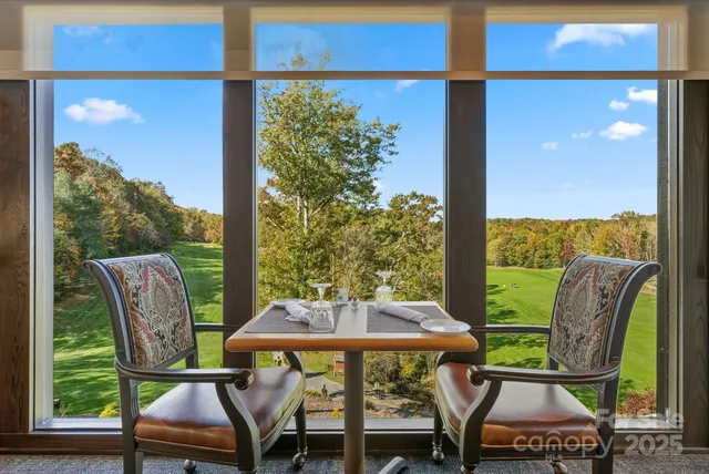 a view of a chairs and table in the patio