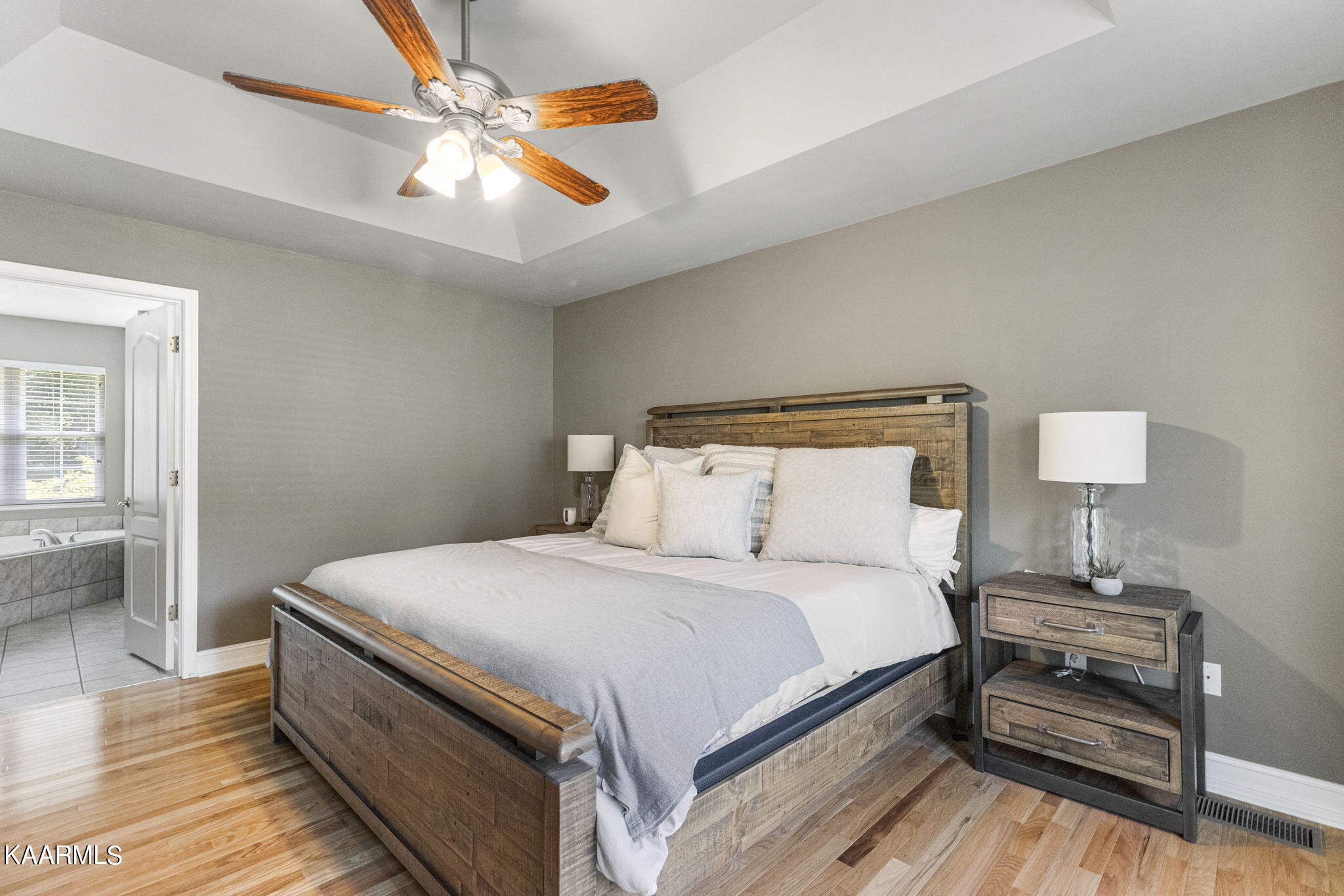 4855 Cameron Road Morristown, TN 37814 - Photo 11 of 25 a bedroom with bed and a chandelier