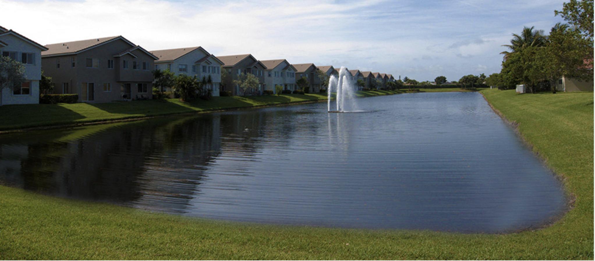 2043 Oakhurst Way Riviera Beach, FL 33404 - Photo 44 of 52 LAKE WATER WITH FOUNTAIN