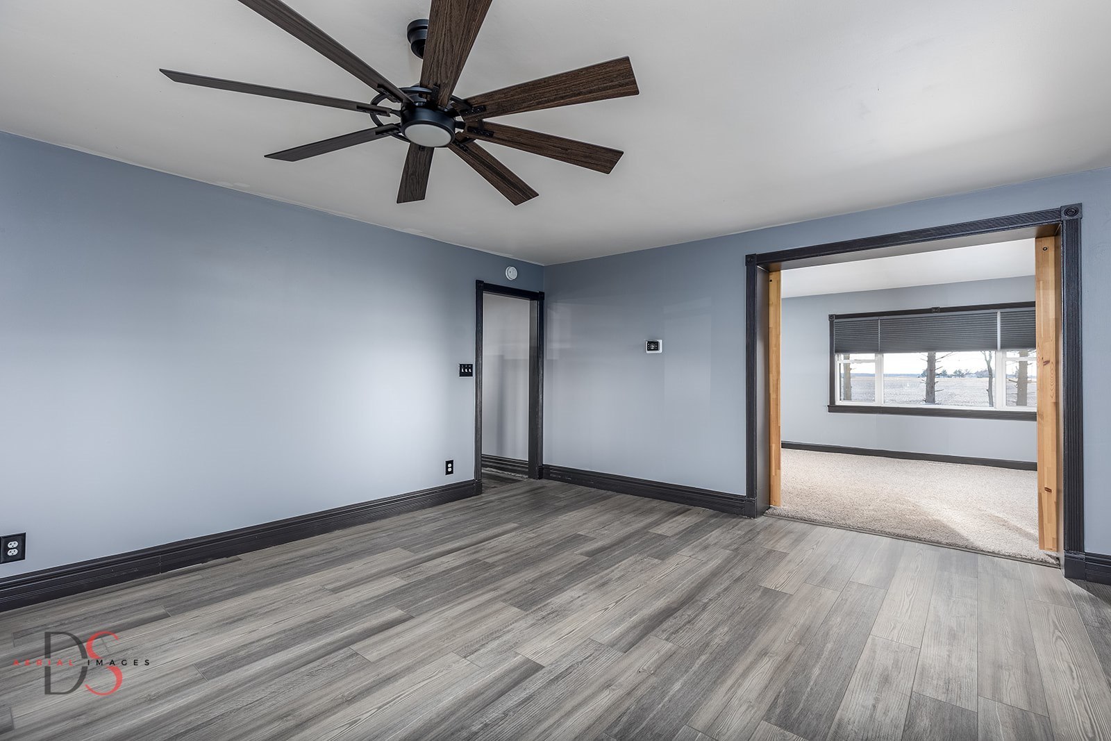 4775 West Dupont Road Morris, IL 60450 - Photo 17 of 24 a view of an empty room and window with a ceiling fan