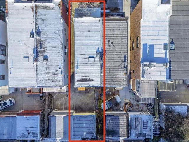 a view of a brick house with an outdoor space