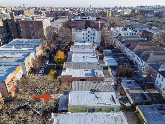 an aerial view of a house with outdoor space