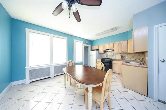 a kitchen with appliances and cabinets