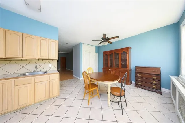 a dining room with furniture and window