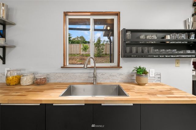 a kitchen with a sink and a window