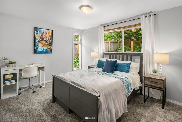 a bedroom with a bed and a table in it