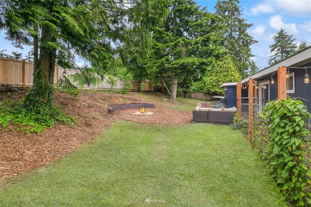 a backyard of a house with seating space
