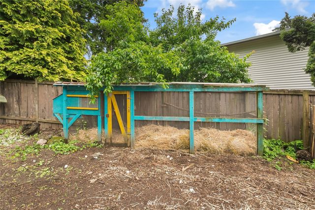 a view of a backyard with a small cabin