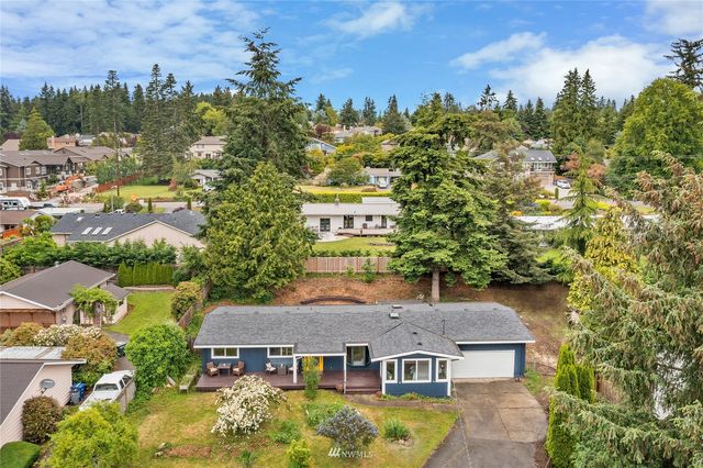 aerial view of a house with a yard