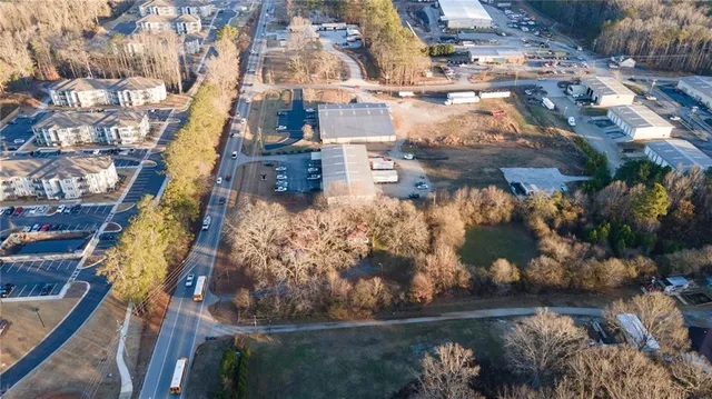 an aerial view of a house with yard swimming pool and outdoor seating