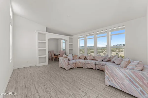 a living room with furniture and a large window