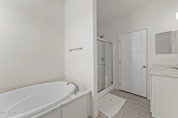 a bathroom with a bathtub and a shower