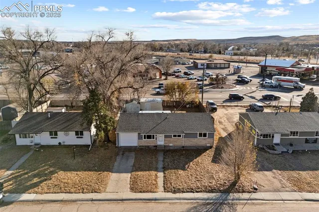 an aerial view of residential houses with outdoor space