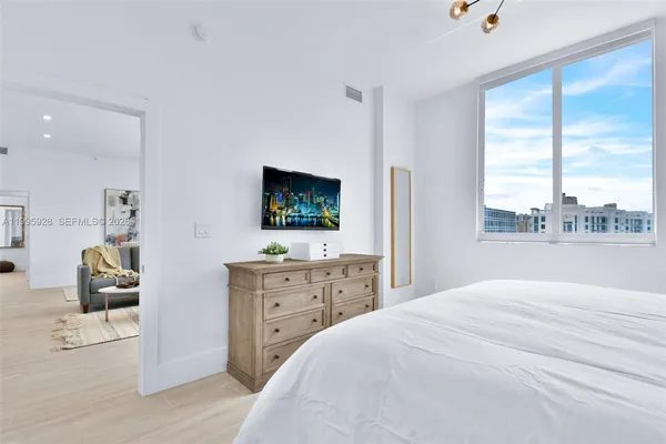 a bedroom with a bed and a table