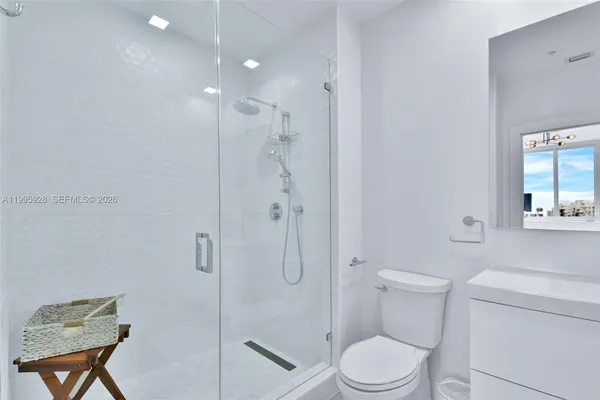 a bedroom with a bed and cabinets