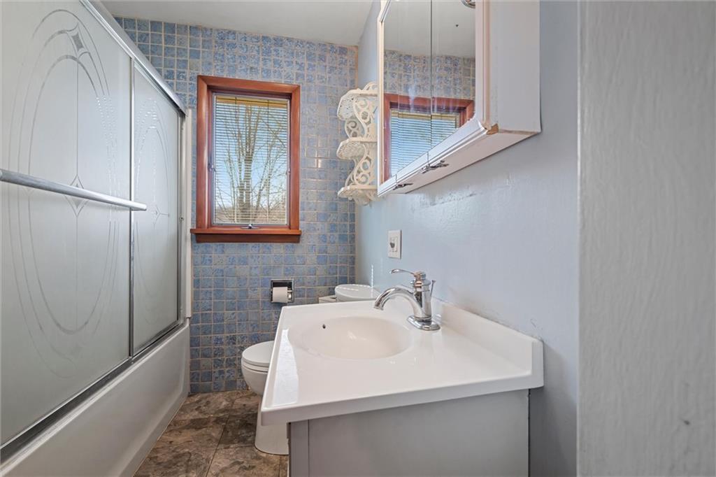 865 Wheatland Road West Middlesex, PA 16159 - Photo 11 of 24 a bathroom with a sink and a mirror