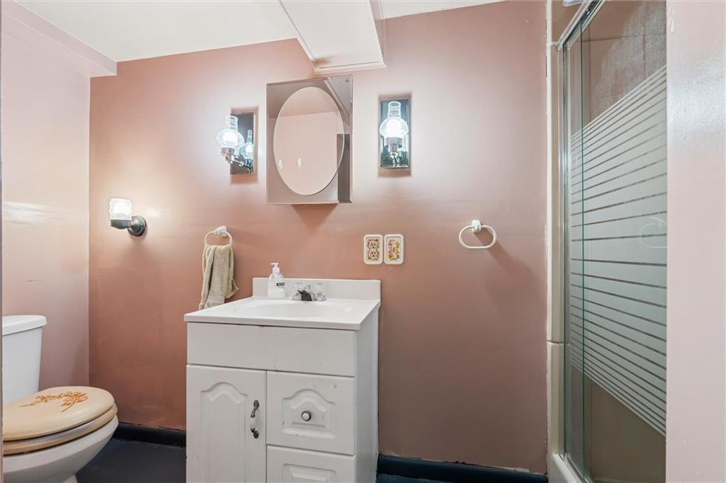 865 Wheatland Road West Middlesex, PA 16159 - Photo 17 of 24 a bathroom with a toilet a sink and mirror