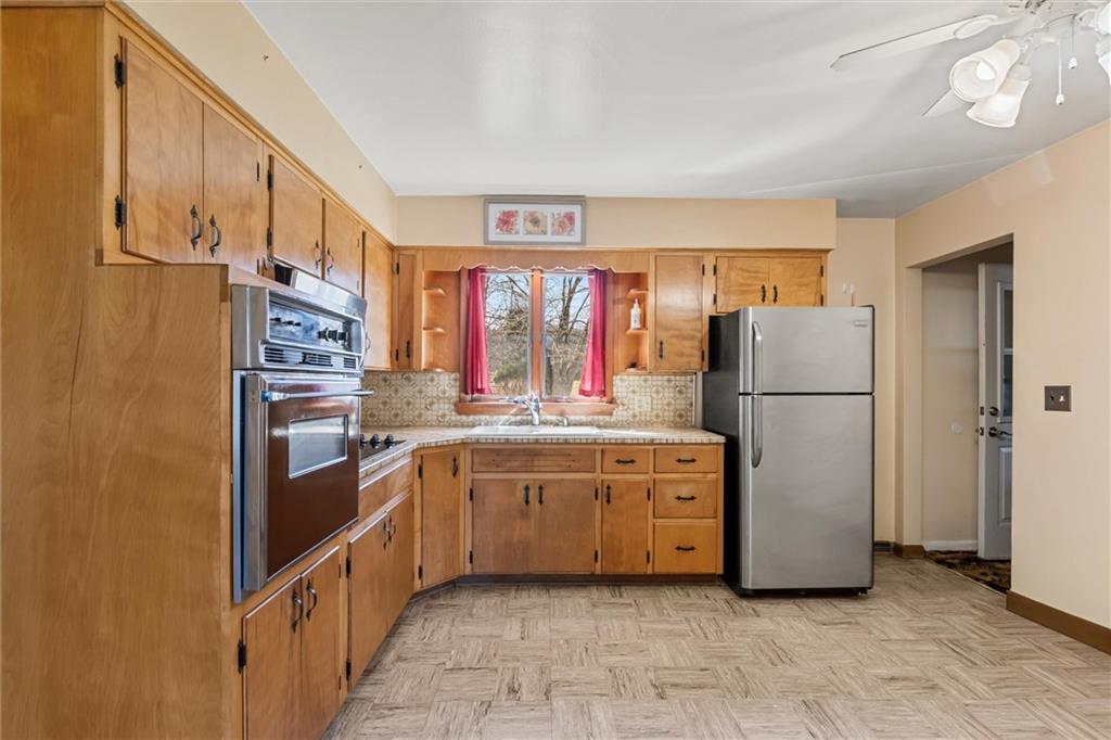 865 Wheatland Road West Middlesex, PA 16159 - Photo 3 of 24 a kitchen with stainless steel appliances granite countertop a refrigerator and a stove