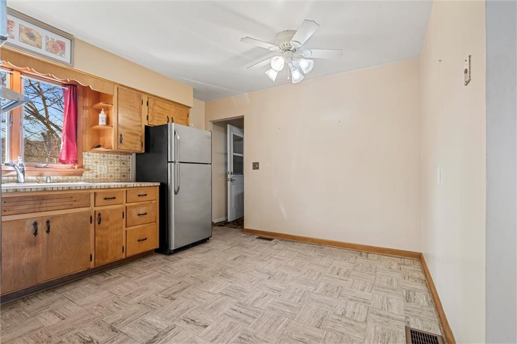 865 Wheatland Road West Middlesex, PA 16159 - Photo 5 of 24 a kitchen with cabinets a refrigerator and a sink