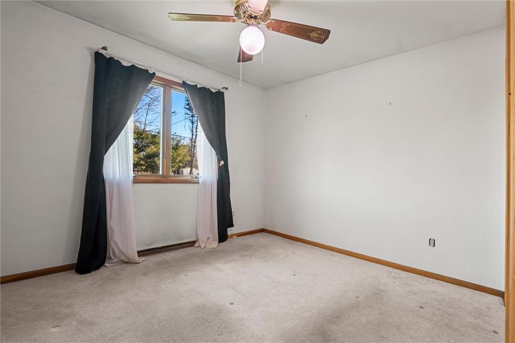865 Wheatland Road West Middlesex, PA 16159 - Photo 6 of 24 an empty room with windows and ceiling fan