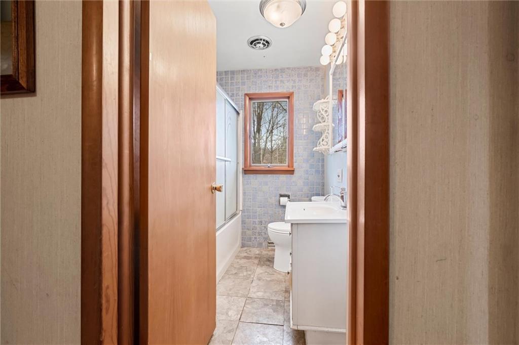 865 Wheatland Road West Middlesex, PA 16159 - Photo 10 of 24 a bathroom with a sink a toilet and shower