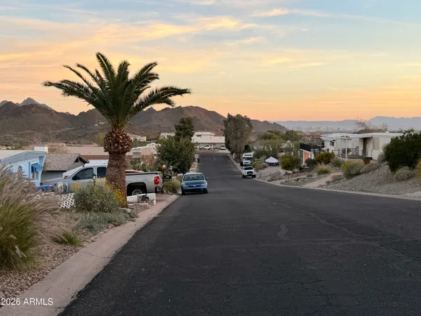 a view of multiple houses with a road
