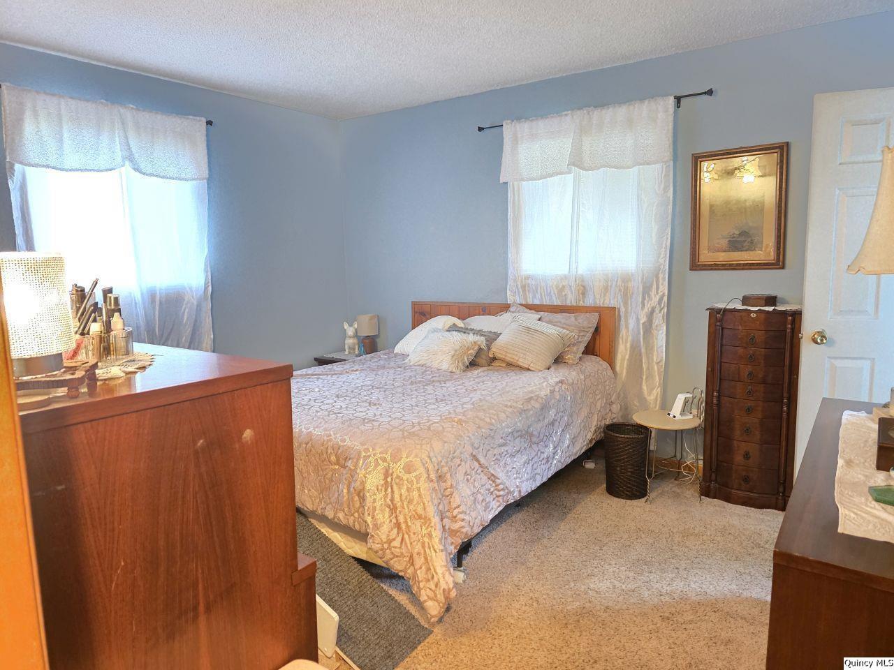 470 Alvord Street Hamilton, IL 62341 - Photo 6 of 7 a bedroom with bed and window