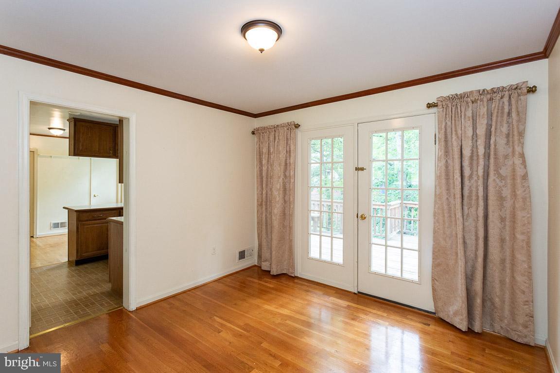 6811 Brisbane Street Springfield, VA 22152 - Photo 11 of 22 Dining room with access to deck