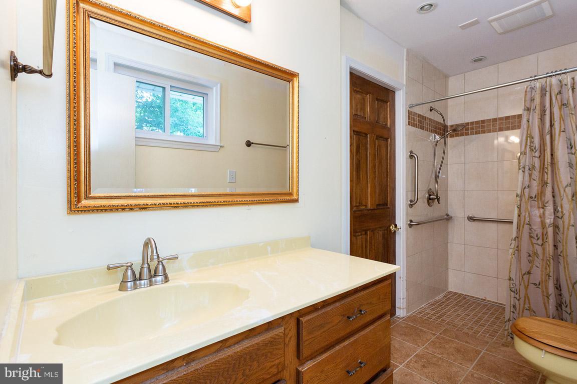 6811 Brisbane Street Springfield, VA 22152 - Photo 13 of 22 Full bathroom was added to main level.